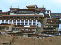 Everyone in a Tibetan Monastery except lamas (teachers) can be called trapa meaning student or scholar there being no specific term for novice monk such as this one. Anjue Monastery, Kangding.