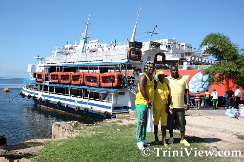 The promoters strike a pose in front of the Treasure Queen cruise vessel