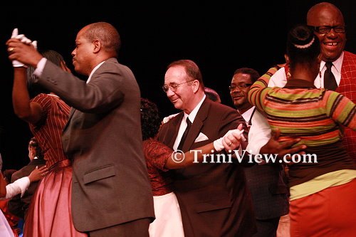 CENTER: UDeCOTT executive chairman Calder Hart and other guests dance on the stage