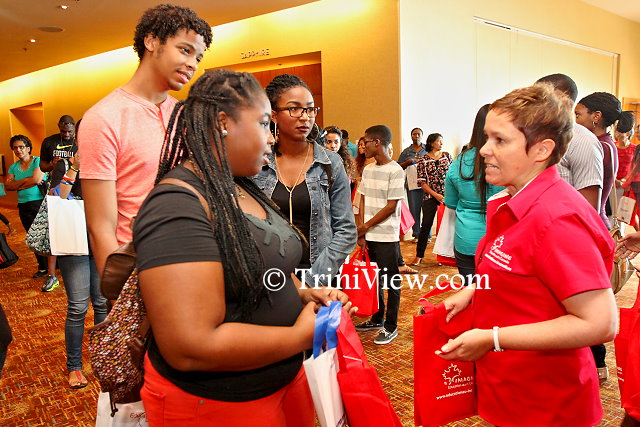 (L) Kezia Huggins, Haydon George and Markaisha De Four chat with Debra Boyce, Senior Trade Commissioner, with the High Commission of Canada to Trinidad and Tobago