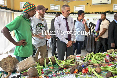 (3rd from left)...His Excellency Anthony Carmona during a brief tour at the base camp