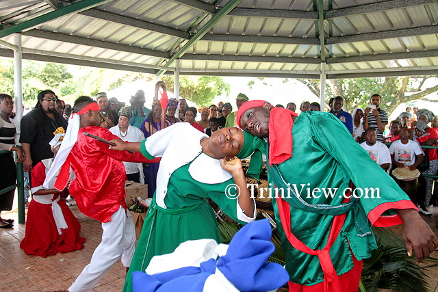 A performance in memory of Junior Noel at the Caroni Cremation Site