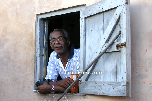 Looking through the window of a parlor in Blanchisseuse