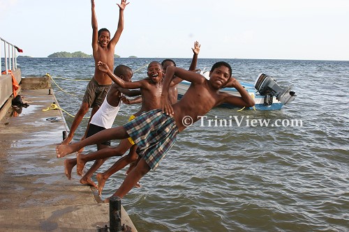 Children diving from the jetty