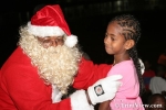 Santa Claus presents gifts to the children
